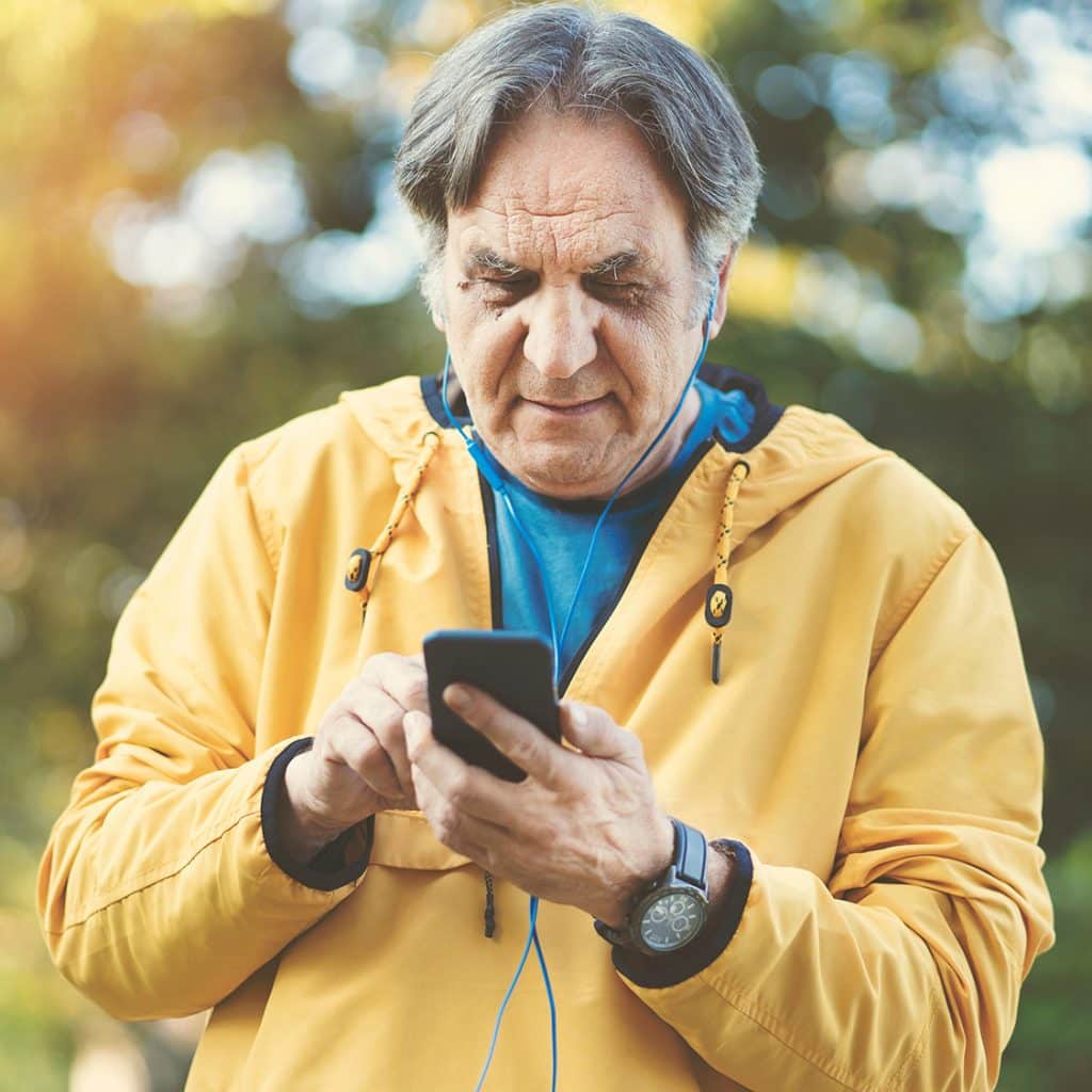 Man on his phone in a park